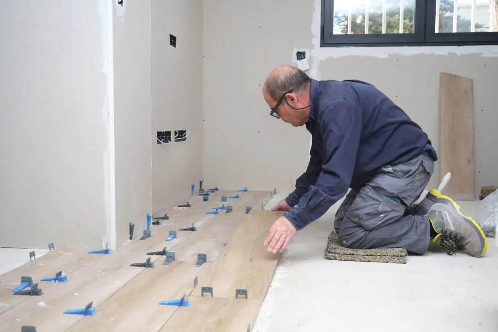 Senior Mason Laying Ceramic Wood Effect Tiles 2025 03 18 13 46 27 Utc
