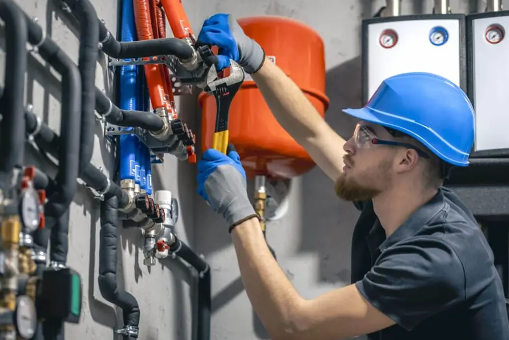 Man Installs Heating System House Checks Pipes With Wrench 1024X683