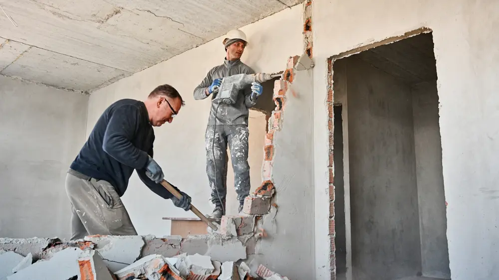 Male Workers Breaking Wall In Apartment Under Reno 2025 01 16 22 14 17 Utc